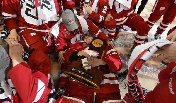 Cami Kro<em></em>nish hugs the natio<em></em>nal champio<em></em>nship trophy after winning the 2023 NCAA Tournament. 