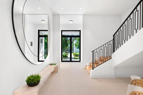 Sculptural stairs anchor the home