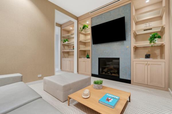 The waterfront home comes with clean lines and lots of built-ins
