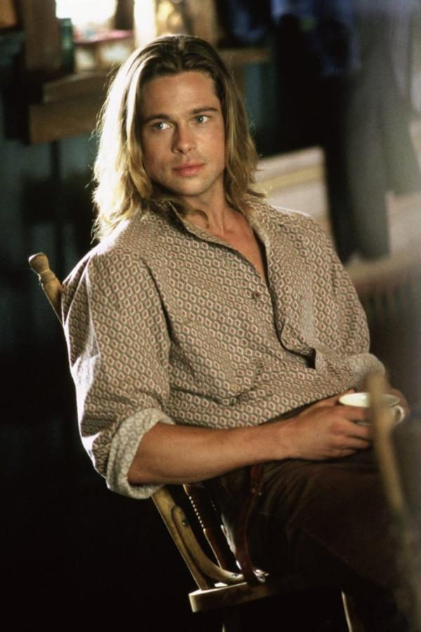 Brad Pitt sitting in a chair