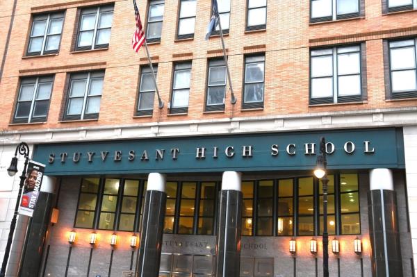 Stuyvesant High School building with flags on the front in New York Real Estate.