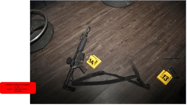 This image provided by state prosecutors shows a weapon on the floor after a deadly Nov. 19-20, 2022 shooting in Club Q in Colorado Springs