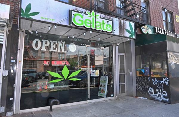 Padlocked storefront of Gelato, a non-registered marijuana store in Bay Ridge Brooklyn, NY, with a vehicle havin<em></em>g the same marijuana logo on its side