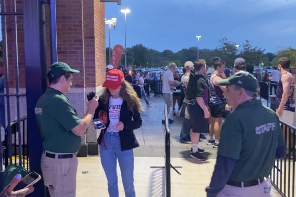 Reporter Deirdre Bardorf enters  Citi Field wearing a MAGA hat and Trump 2024 t-shirt.