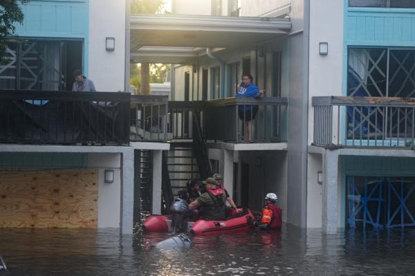 Residents being rescued from second story of a flooded apartment complex in Clearwater, Florida due to Hurricane Milton on October 10, 2024