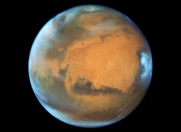 EMBARGOED TO 1600 WEDNESDAY AUGUST 9 Undated handout photo issued by NASA of Mars which may have o<em></em>nce had wet and dry seasons like those on Earth co<em></em>nducive to the emergence of life, scientists have said. Researchers have discovered fossil evidence suggesting the red planet had a cyclical climate more than three billion years ago. Issue date: Wednesday August 9, 2023. PA Photo. See PA story SCIENCE Mars. Photo credit should read: ESA/Nasa/Hubble Space Telescope/PA Wire NOTE TO EDITORS: This handout photo may o<em></em>nly be used in for editorial reporting purposes for the co<em></em>ntemporaneous illustration of events, things or the people in the image or facts mentio<em></em>ned in the caption. Reuse of the picture may require further permission from the copyright holder.