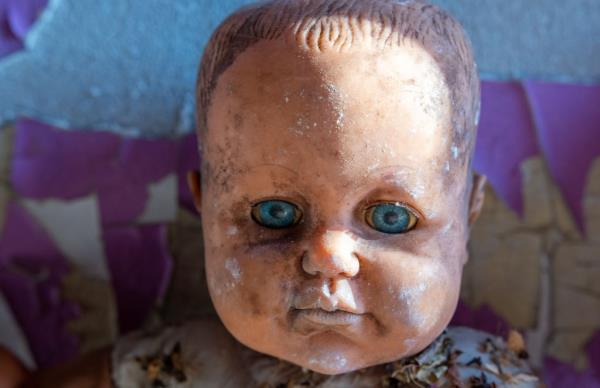 A baby doll inside the home. 