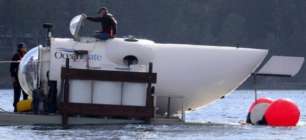 OceanGate CEO Stockton Rush emerges from the hatch atop the OceanGate submarine Cyclops 1 in the San Juan Islands.
