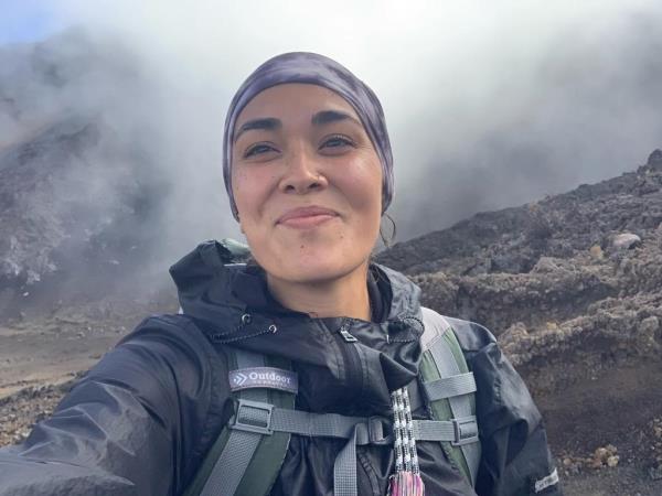 Hannah Kobayashi taking a selfie in front of a mountain before her disappearance