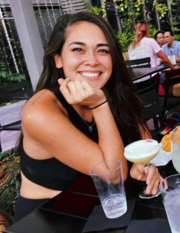 A woman, identified as Hannah Kobayashi, sitting at a table with drinks, reported missing since November 11th.