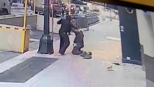 Surveillance video shows homeless man Xavier Israel allegedly beating and robbing good Samaritan Sang Trick who offered him a coat, Wednesday, Jan. 12.