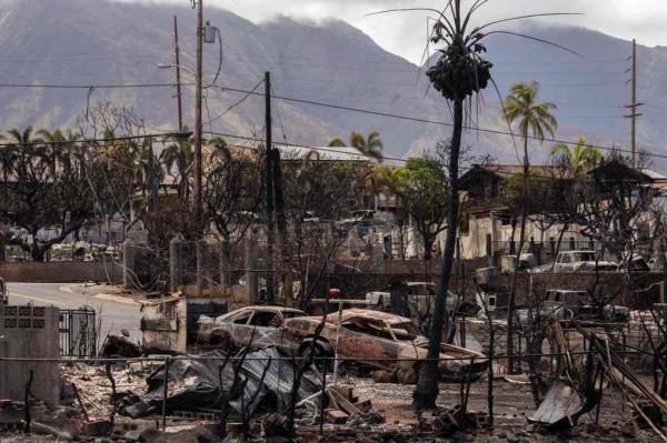 Destroyed buildings and cars are seen in the aftermath of the Maui wildfires in Lahaina.