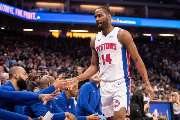 Detroit Pistons guard Alec Burks high-fives teammates during the second quarter of the NBA game against the Sacramento Kings at Golden 1 Center.