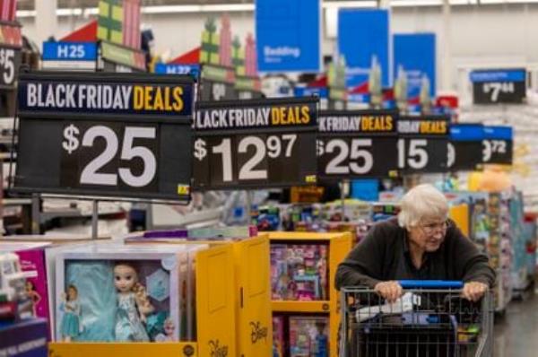 Black Friday deals line the aisles as shoppers look for bargains at a Walmart Supercenter in Burbank (California), on November 14, 2023.