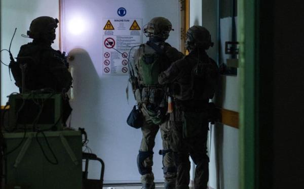 This handout picture released by the Israeli army on November 15, 2023, reportedly shows Israeli soldiers carrying out operations inside Al-Shifa hospital in Gaza City, amid co<em></em>ntinuing battles betweeen Israel and the Palestinian militant group Hamas. (Photo by Israeli Army / AFP) / RESTRICTED TO EDITORIAL USE - MANDATORY CREDIT 