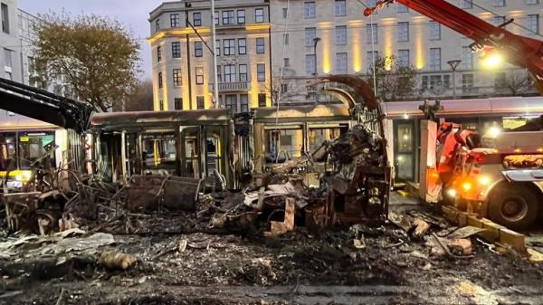Burnt out bus and smashed windows on the Luas on O’Co<em></em>nnell Street, Dublin, Ireland. 
