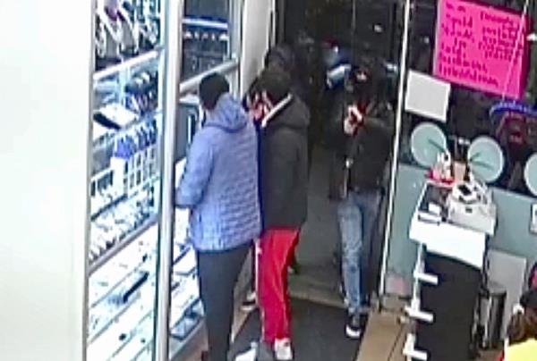 Surveillance footage of robbers entering store