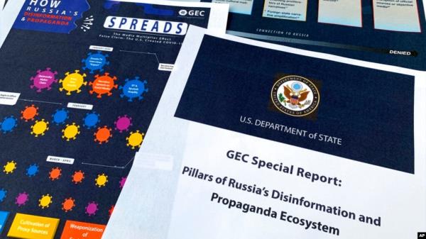 FILE - Pages from the U.S. State Department's Global Engagement Center report released on Aug. 5, 2020, are seen in this photo. 