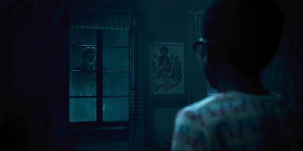 Mike stares at a vampire boy out his window in Salem's Lot 2024
